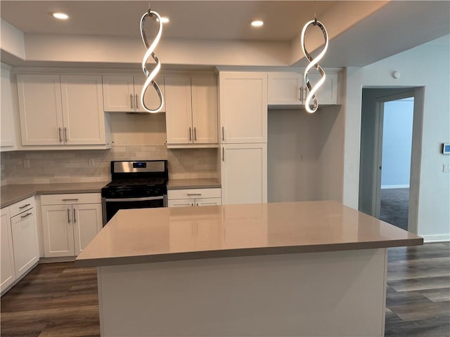 9360 Calm Water Pl, Rancho Cucamonga, CA 91730 - kitchen with gas range, dark wood-type flooring, backsplash, white cabinets, and recessed lighting