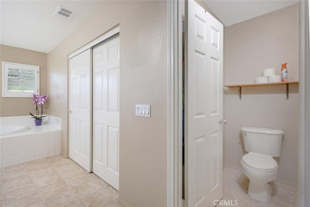 26808 Lemon Grass Way, Murrieta, CA 92562 - bathroom featuring a bath, toilet, and tile patterned floors