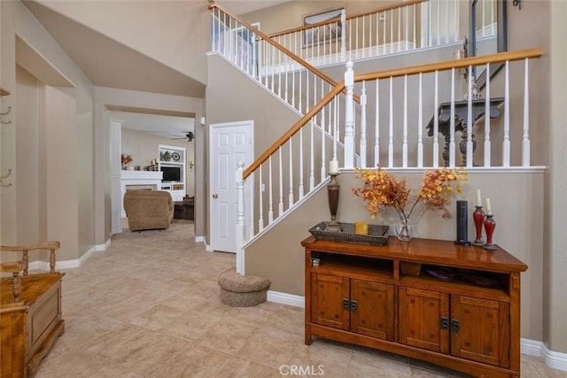 26808 Lemon Grass Way, Murrieta, CA 92562 - entryway with a ceiling fan, baseboards, stairs, and a fireplace