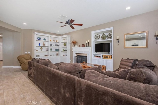 26808 Lemon Grass Way, Murrieta, CA 92562 - living area with a ceiling fan, a premium fireplace, built in shelves, recessed lighting, and light tile patterned flooring