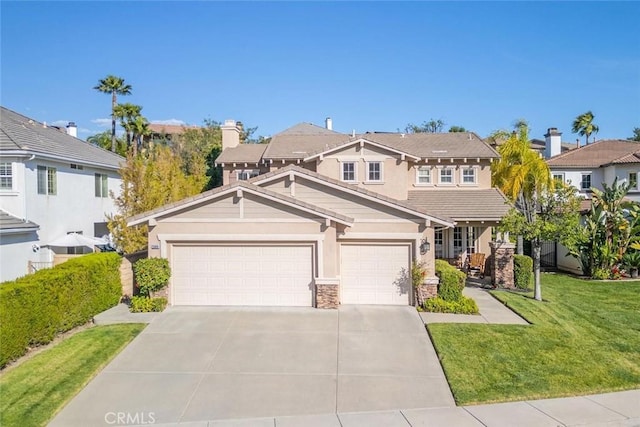 26808 Lemon Grass Way, Murrieta, CA 92562 - view of front of property featuring concrete driveway, a front lawn, stone siding, and an attached garage