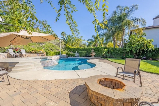 26808 Lemon Grass Way, Murrieta, CA 92562 - view of pool with a patio area, an outdoor fire pit, a fenced backyard, and a pool with connected hot tub