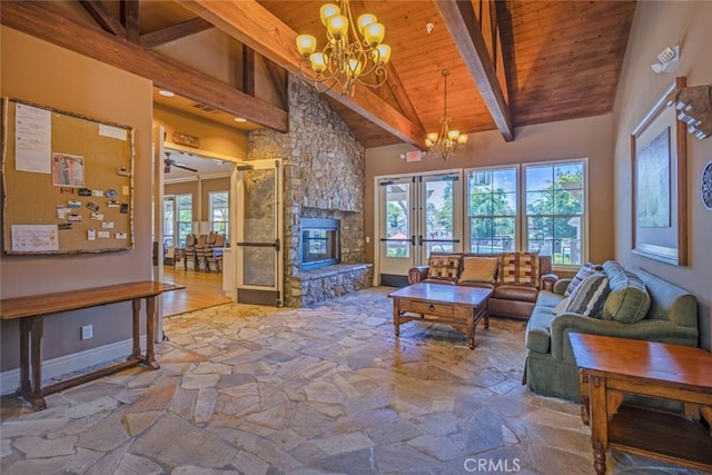 26808 Lemon Grass Way, Murrieta, CA 92562 - living area with a chandelier, wooden ceiling with exposed beams, stone flooring, high vaulted ceiling, and french doors