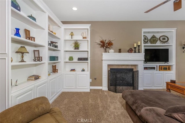 26808 Lemon Grass Way, Murrieta, CA 92562 - living area featuring a tile fireplace, carpet, a ceiling fan, and built in features