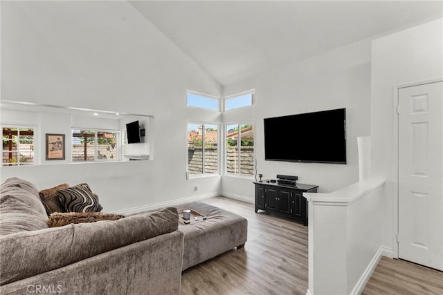 19777 Azure Field Dr, Newhall, CA 91321 - living area featuring light wood-style floors, baseboards, and high vaulted ceiling