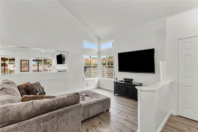 19777 Azure Field Dr, Newhall, CA 91321 - living area featuring light wood finished floors and high vaulted ceiling