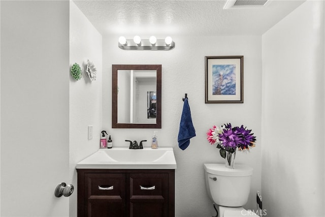 19777 Azure Field Dr, Newhall, CA 91321 - bathroom with toilet, vanity, and a textured ceiling