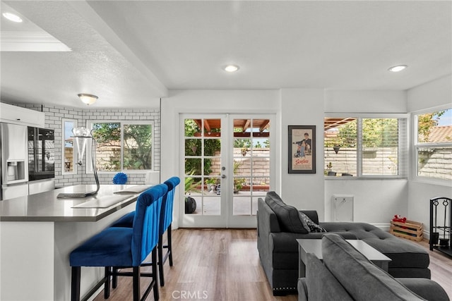 19777 Azure Field Dr, Newhall, CA 91321 - living area featuring french doors, light wood-style floors, and recessed lighting