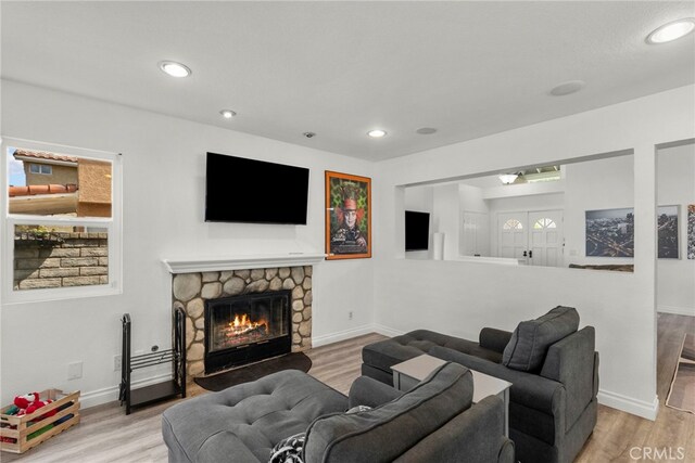 19777 Azure Field Dr, Newhall, CA 91321 - living area with a fireplace, wood finished floors, and recessed lighting