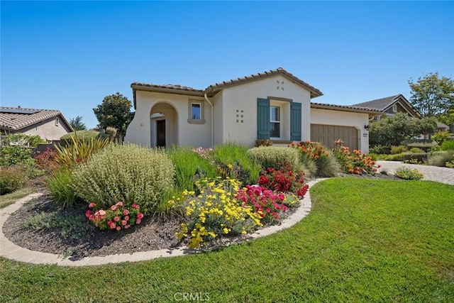 1824 Nathan Way, Nipomo, CA 93444 - mediterranean / spanish-style home featuring stucco siding, a garage, a front yard, driveway, and a tiled roof