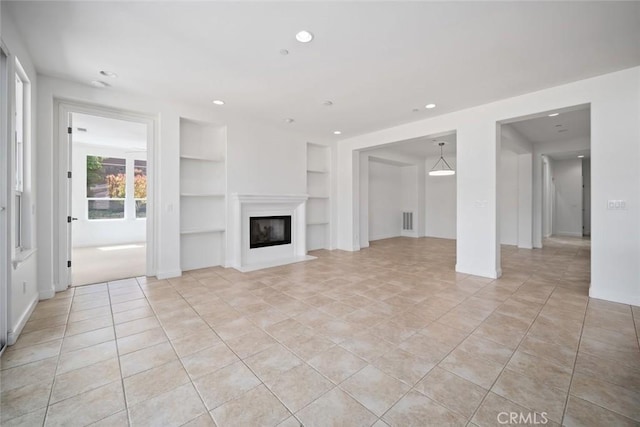 1824 Nathan Way, Nipomo, CA 93444 - unfurnished living room featuring built in features, recessed lighting, light tile patterned flooring, a glass covered fireplace, and baseboards