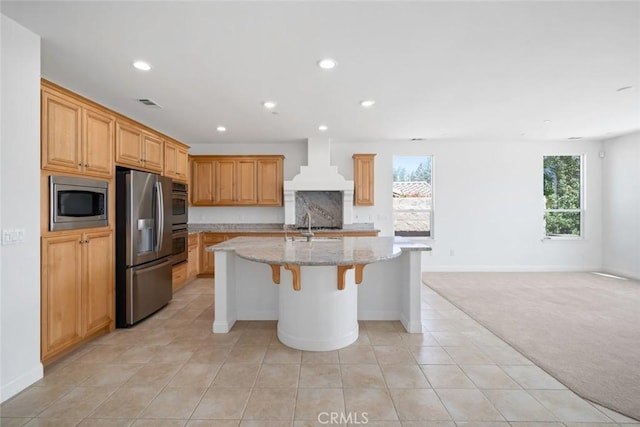 1824 Nathan Way, Nipomo, CA 93444 - kitchen featuring appliances with stainless steel finishes, custom range hood, recessed lighting, light carpet, and an island with sink