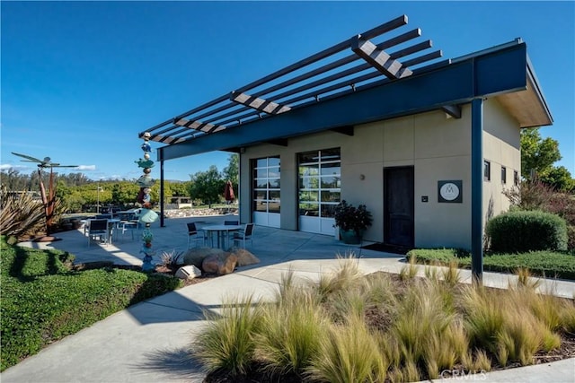 1824 Nathan Way, Nipomo, CA 93444 - view of front facade featuring a pergola, a patio, and stucco siding