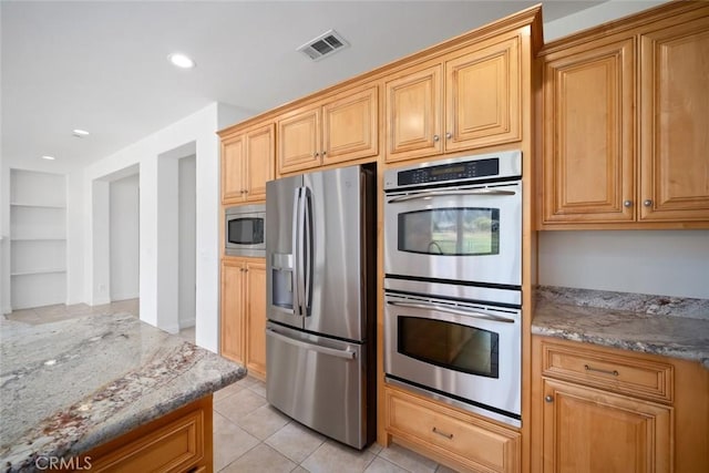 1824 Nathan Way, Nipomo, CA 93444 - kitchen with stainless steel appliances, light stone countertops, light tile patterned floors, built in shelves, and recessed lighting