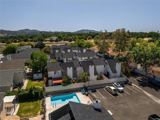 10710 El Camino Real Unit 17, Atascadero, CA 93422 - aerial perspective of suburban area featuring a pool area and a mountain backdrop