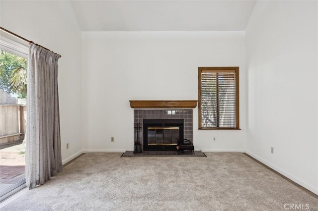 10710 El Camino Real Unit 17, Atascadero, CA 93422 - unfurnished living room featuring carpet flooring, plenty of natural light, and a tiled fireplace