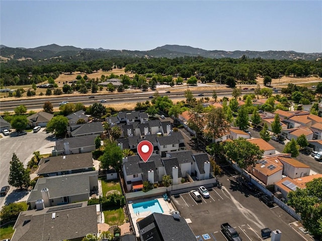 10710 El Camino Real Unit 17, Atascadero, CA 93422 - aerial view of residential area featuring a mountainous background and a pool