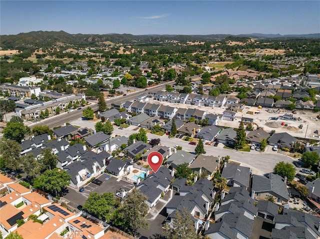 10710 El Camino Real Unit 17, Atascadero, CA 93422 - aerial overview of property's location with nearby suburban area and a mountain backdrop