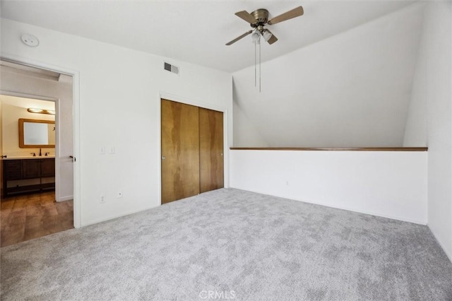 10710 El Camino Real Unit 17, Atascadero, CA 93422 - unfurnished bedroom featuring carpet floors, lofted ceiling, a closet, a sink, and a ceiling fan