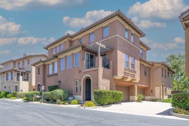 2772 Piantino Cir, San Diego, CA 92108 - view of building exterior featuring an attached garage and driveway