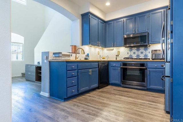2772 Piantino Cir, San Diego, CA 92108 - kitchen with appliances with stainless steel finishes, blue cabinets, light wood-type flooring, and recessed lighting