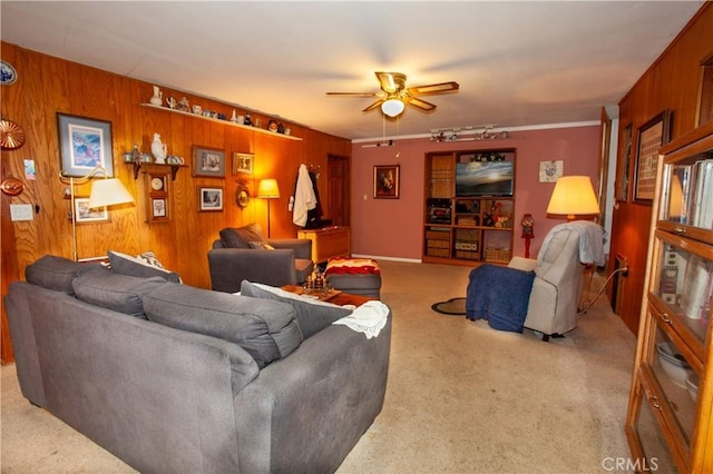 31510 Overhill Dr, Running Springs, CA 92382 - living area featuring carpet flooring, a ceiling fan, and wood walls
