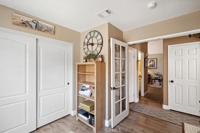 29159 Palm View Ln, Highland, CA 92346 - interior space with french doors, light wood-style flooring, and baseboards