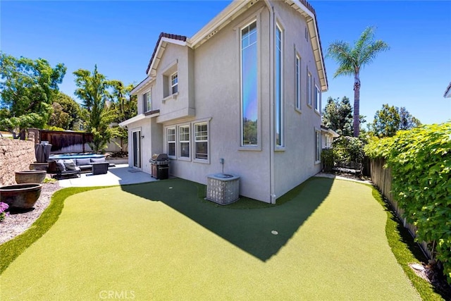 6121 Camino Forestal, San Clemente, CA 92673 - rear view of property featuring stucco siding, a patio area, and an area to practice putting
