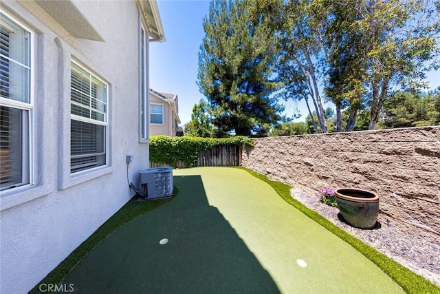 6121 Camino Forestal, San Clemente, CA 92673 - fenced backyard featuring central air condition unit and a putting area