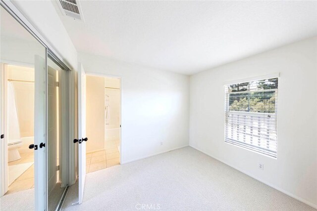 6121 Camino Forestal, San Clemente, CA 92673 - unfurnished bedroom featuring carpet floors, ensuite bathroom, baseboards, and tile patterned flooring