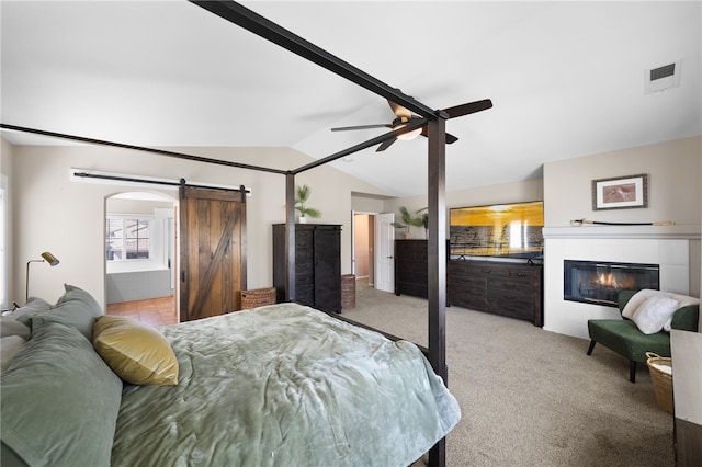 23650 Kathryn St, Murrieta, CA 92562 - bedroom featuring a barn door, vaulted ceiling, carpet floors, a fireplace, and ceiling fan