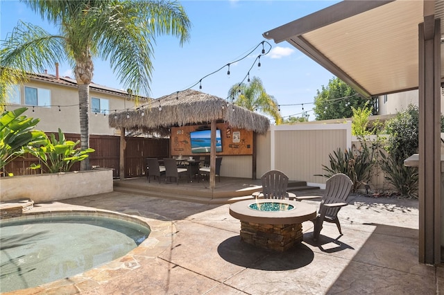 23650 Kathryn St, Murrieta, CA 92562 - fenced backyard with an outdoor fire pit, a patio area, outdoor dining space, and a gazebo