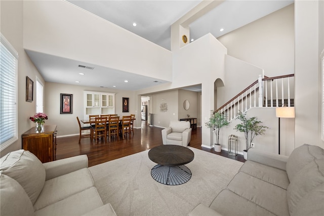 23650 Kathryn St, Murrieta, CA 92562 - living area featuring wood finished floors, stairs, recessed lighting, baseboards, and a towering ceiling