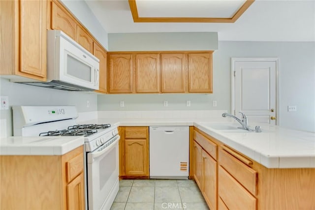 11241 Pleasant Hills Dr, Apple Valley, CA 92308 - kitchen featuring white appliances, a peninsula, light tile patterned floors, a sink, and tile counters