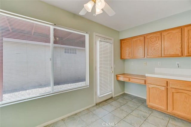 11241 Pleasant Hills Dr, Apple Valley, CA 92308 - kitchen with tile countertops, a ceiling fan, baseboards, and light tile patterned flooring