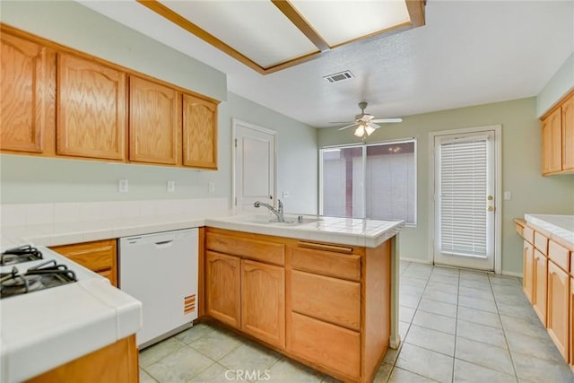 11241 Pleasant Hills Dr, Apple Valley, CA 92308 - kitchen featuring white dishwasher, a peninsula, a sink, and light tile patterned flooring