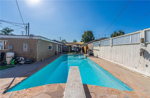 1915 E 55th St, Long Beach, CA 90805 - view of swimming pool featuring a diving board