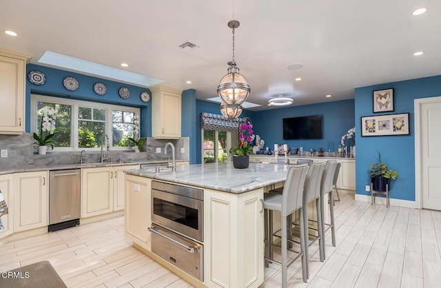 4409 Encinas Dr, La Canada Flintridge, CA 91011 - kitchen with a warming drawer, a sink, healthy amount of natural light, stainless steel microwave, and recessed lighting