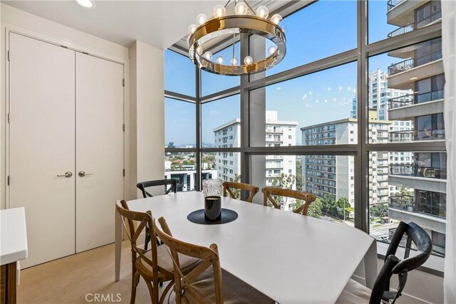 10776 Wilshire Blvd Unit 901, Los Angeles, CA 90024 - dining space with a view of city, a chandelier, plenty of natural light, and expansive windows