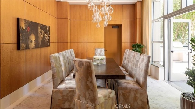 10776 Wilshire Blvd Unit 901, Los Angeles, CA 90024 - dining area with a chandelier and wood walls