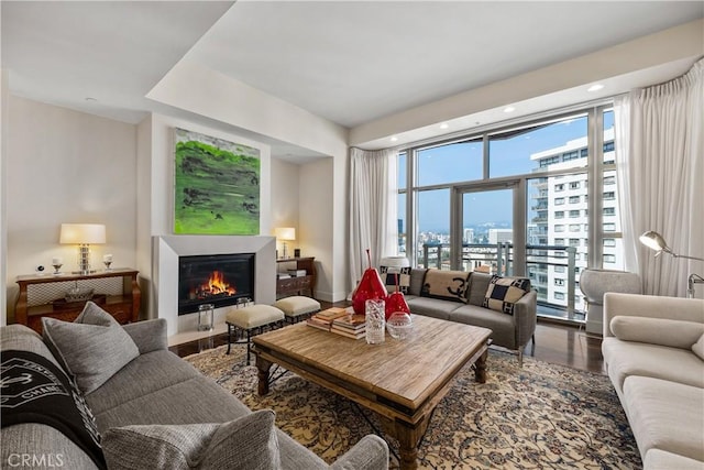 10776 Wilshire Blvd Unit 901, Los Angeles, CA 90024 - living room with wood finished floors, a glass covered fireplace, recessed lighting, and a view of city
