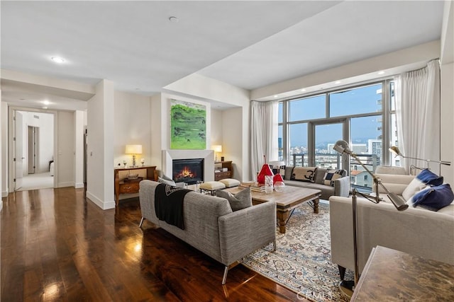 10776 Wilshire Blvd Unit 901, Los Angeles, CA 90024 - living room featuring wood finished floors, a lit fireplace, recessed lighting, and baseboards