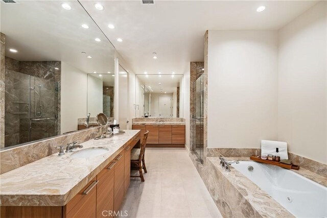 10776 Wilshire Blvd Unit 901, Los Angeles, CA 90024 - full bath featuring recessed lighting, a stall shower, vanity, a tub with jets, and tile patterned floors