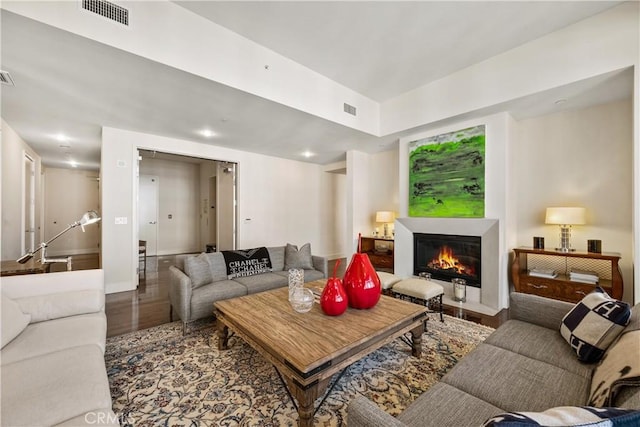 10776 Wilshire Blvd Unit 901, Los Angeles, CA 90024 - living area with a fireplace with flush hearth, wood finished floors, and baseboards