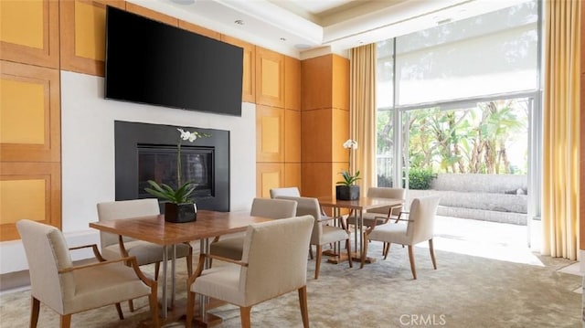 10776 Wilshire Blvd Unit 901, Los Angeles, CA 90024 - dining space with a glass covered fireplace and light carpet