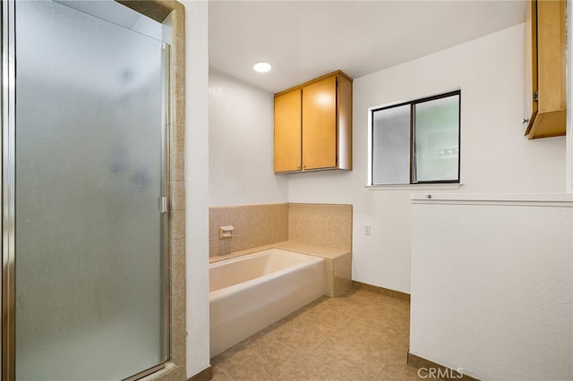 178 E Washington Ave, Chico, CA 95926 - bathroom with a stall shower, a garden tub, tile patterned floors, and baseboards