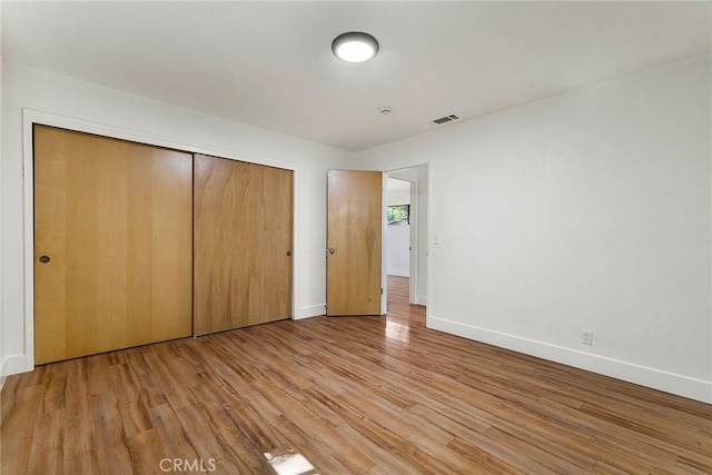 178 E Washington Ave, Chico, CA 95926 - unfurnished bedroom with wood finished floors, a closet, and baseboards