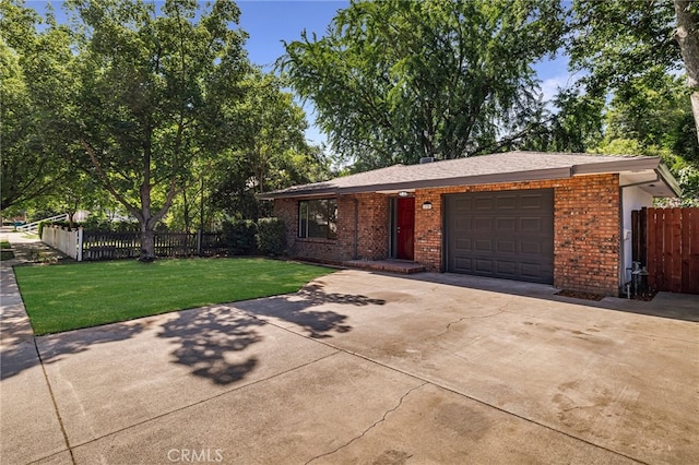 178 E Washington Ave, Chico, CA 95926 - view of front of property featuring brick siding, an attached garage, and driveway