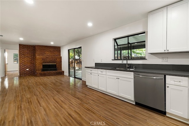 178 E Washington Ave, Chico, CA 95926 - kitchen with a sink, dishwasher, open floor plan, dark countertops, and wood finished floors