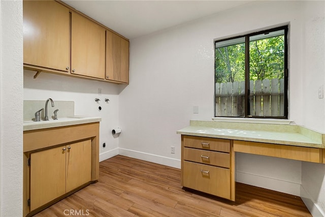 178 E Washington Ave, Chico, CA 95926 - laundry room with light wood finished floors, hookup for a washing machine, an office area, baseboards, and cabinet space